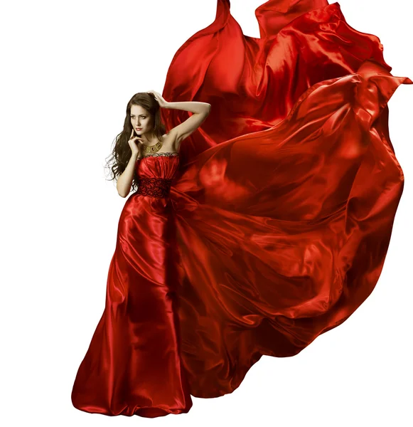 Vestido de moda de belleza de mujer, chica en rojo elegante vestido de seda que ondea la tela, modelo en largo paño ondulante en el viento, aislado sobre fondo blanco — Foto de Stock