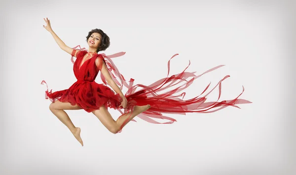 Mulher Correndo em Salto, Menina Performer Leap Dançando em Vestido Vermelho Imagem De Stock