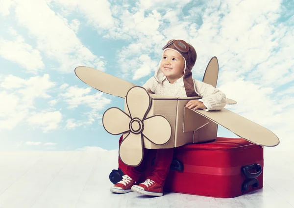 Child Playing Airplane Pilot, Kid Traveler Flying in Helmet on Suitcase