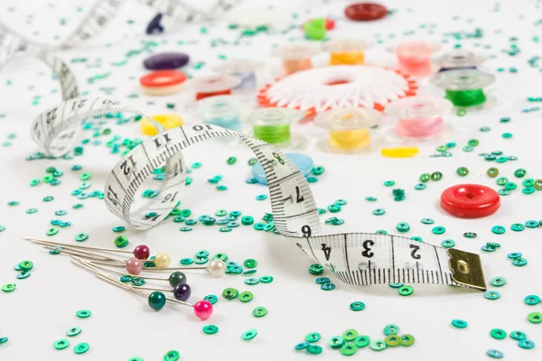 Sewing objects buttons, bobbins, ruler, needles, beads — Stockfoto