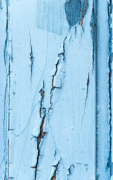 Pintura agrietada azul sobre madera — Foto de Stock