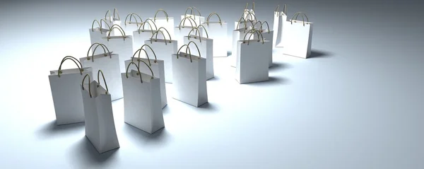 Λευκό τσάντες αγορών σε μια ομάδα του φωτός — Φωτογραφία Αρχείου