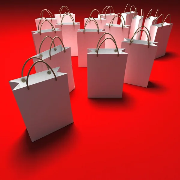 White shopping bags on a red background — Stock Photo, Image