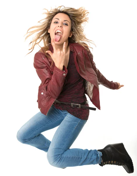 Jumping female rock fan — Stock Photo, Image