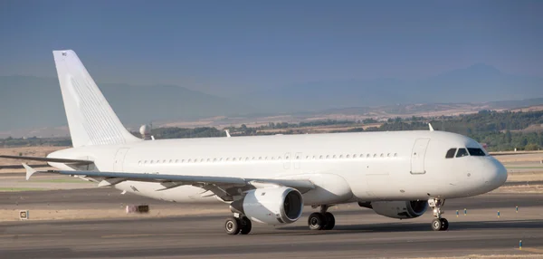 Plane at the airport — Stock Photo, Image