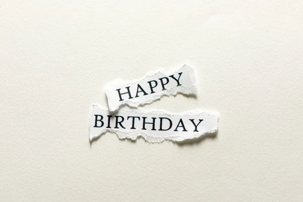 Happy birthday on a piece of paper — Stock Photo, Image