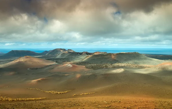 Volcanic landscape and the sea — Stock Photo, Image