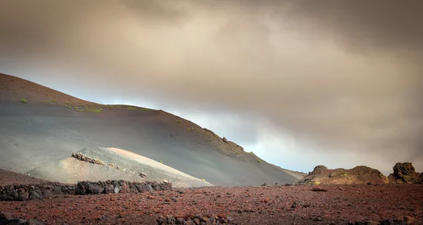 Volcanic landscape and the sea — Stock Photo, Image