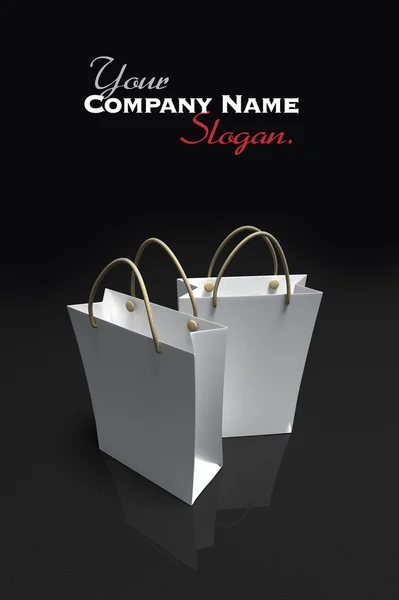 Pair of white shopping bags against a dark background — Stock Photo, Image