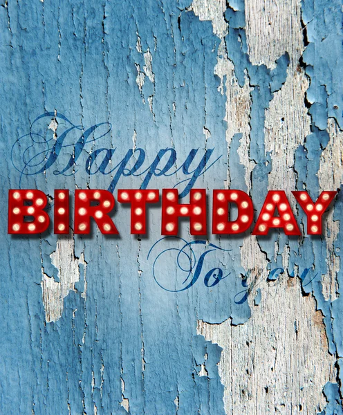 Glowing birthday greetings over distressed paint — Stock Photo, Image