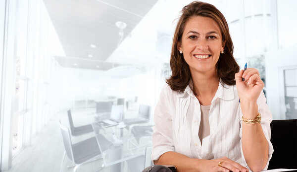 Smiling woman in a business environment