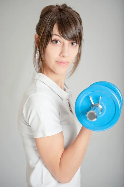 Girl with dumbbell — Stock Photo, Image