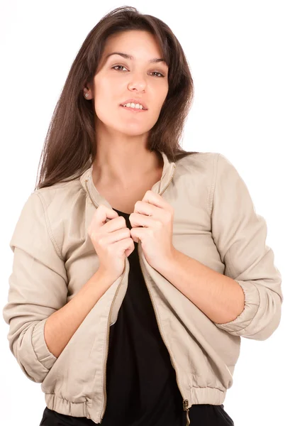 Smiling pretty brunette arranging her jacket — Stock Photo, Image