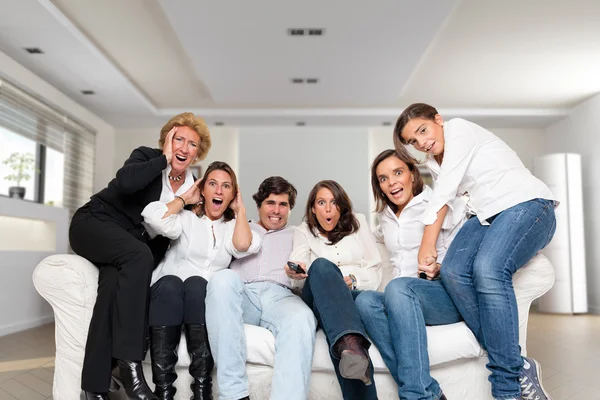 Nervous family watching tv — Stock Photo, Image