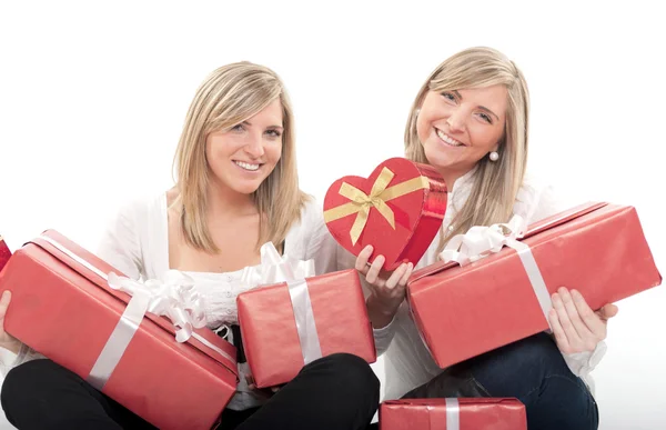 Happy sisters with gifts — Stock Photo, Image