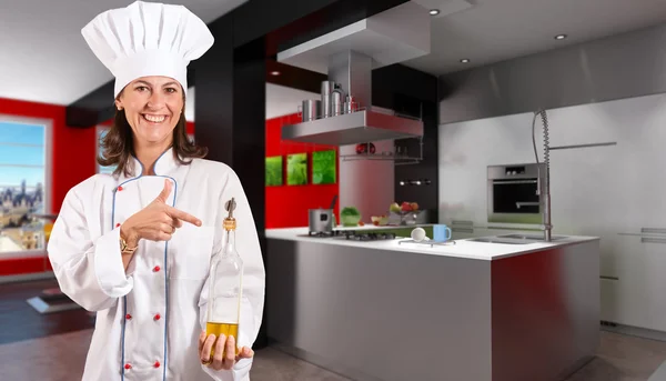 Smiling Female Chef in a designer kitchen — Stock Photo, Image