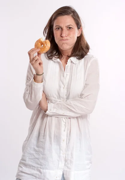 Woman pretending to get fat — Stock Photo, Image