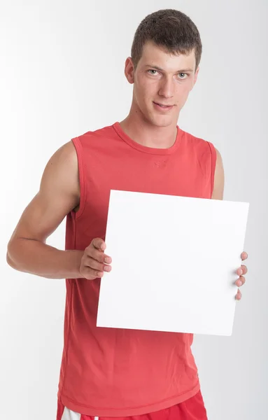 Athlete with sign — Stock Photo, Image