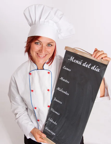 Chef sorrindo segurando placa de menu — Fotografia de Stock