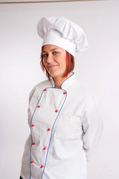 Sorridente cozinheiro profissional feminino — Fotografia de Stock