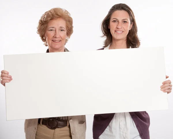 Women holding blank board — Stock Photo, Image
