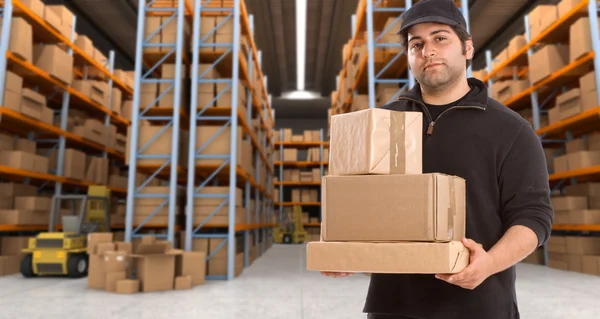 Deliveryman at warehouse h — Stock Photo, Image