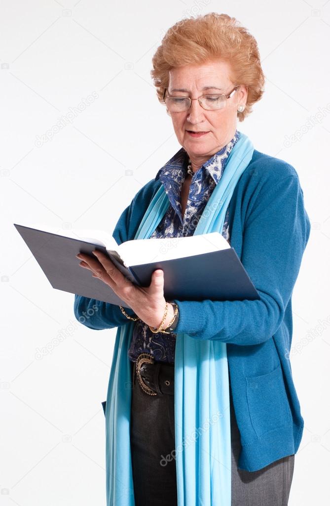 Woman consulting a book