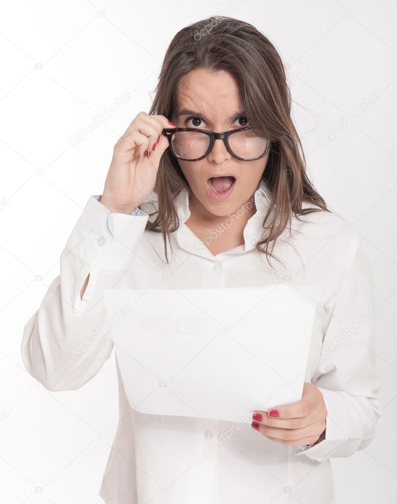 Woman reading shocking document 