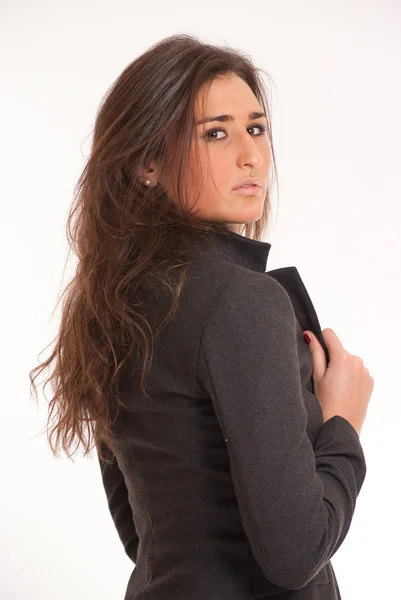 Serious young brunette in a blazer — Stock Photo, Image