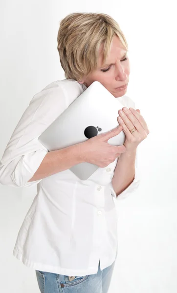 Woman cuddling her pc tablet — Stock Photo, Image