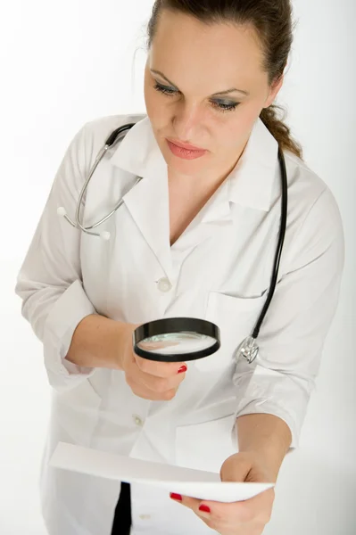 Doctor analyzing lab report — Stock Photo, Image