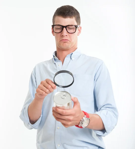 Man inspecting nutrition label — Stock Photo, Image