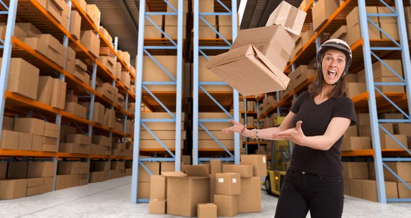 Crazy female courier at warehouse b — Stock Photo, Image