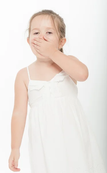 Niña cubriendo su boca —  Fotos de Stock