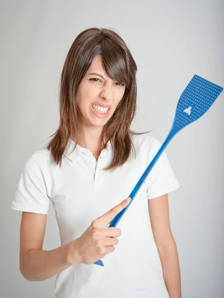 Girl with flyswatter — Stock Photo, Image