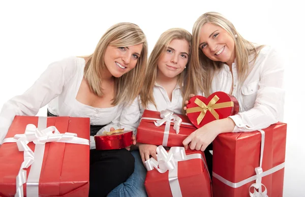 Three sisters with presents — Stock Photo, Image