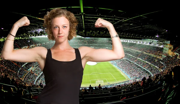 Powerful woman in a football stadium — Stock Photo, Image