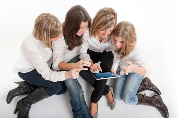 Young females and tablet pc Stock Image