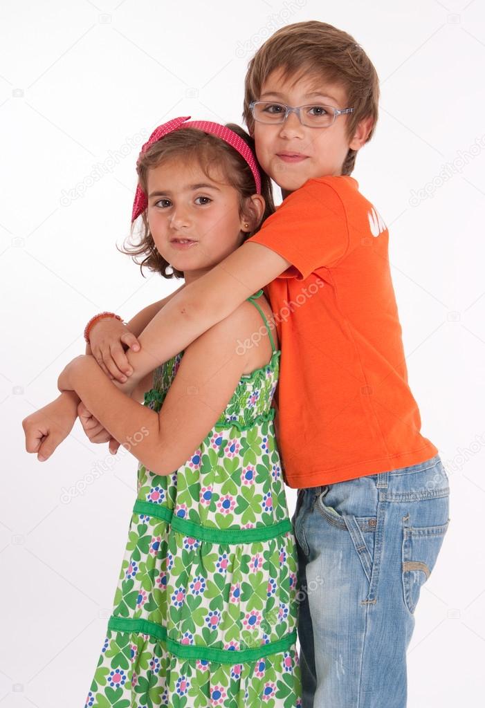 Boy hugging little girl
