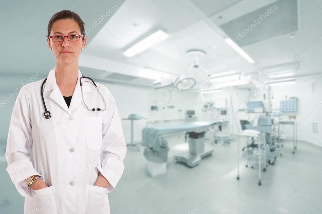 Serious female doctor in operating room