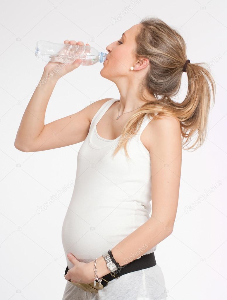 Expectant mother drinking water