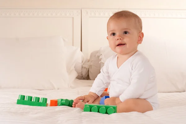 Baby and toy bricks — Stock Photo, Image