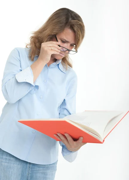 Serious woman reading a book — Stock Photo, Image