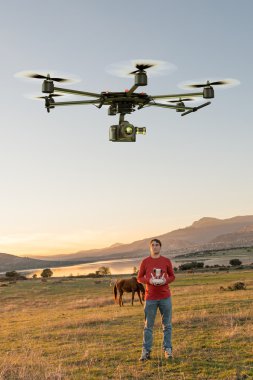 Man guiding a drone clipart