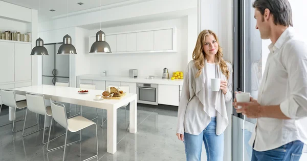 Couple in modern kitchen — Stock Photo, Image