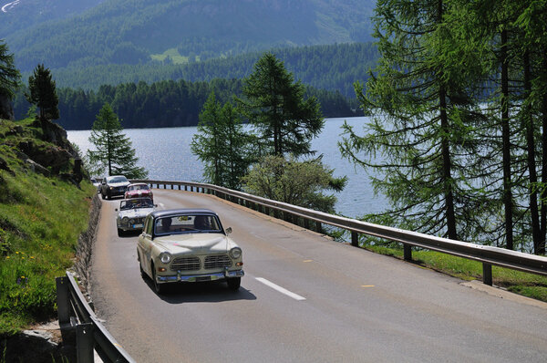 A cream-colored Volvo Amazon and other classic cars