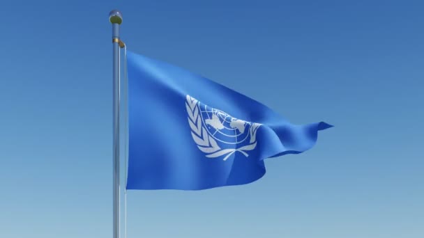 Flag of the United Nations waving against blue sky. 
