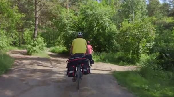 Two Young Men Backpacks Ride Bicycles Road Young Cyclists Ride — Stock Video