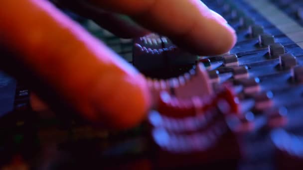 Sound director working on professional audio mixing console. — Stock Video