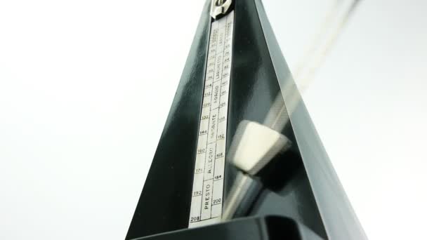 Metronome with fast swinging pendulum — Stock Video